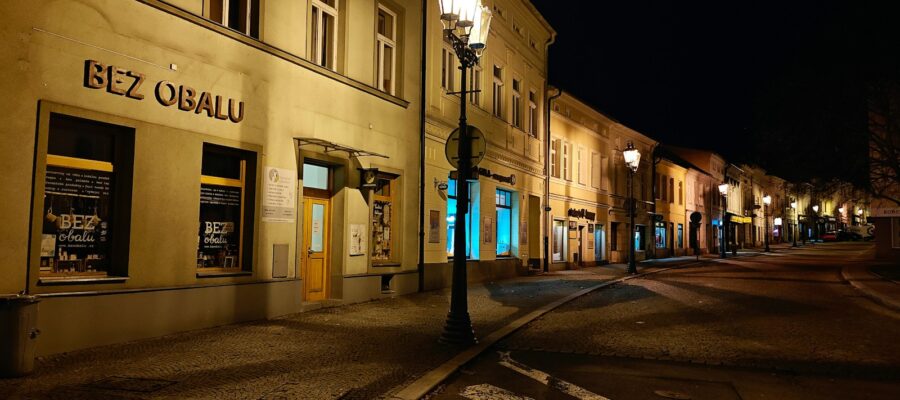 a city street at night with a street light